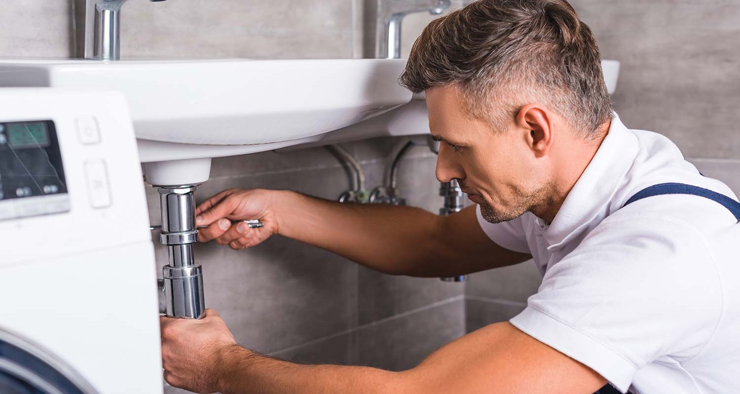 adult-plumber-fixing-sink-at-bathroom-resize.jpg